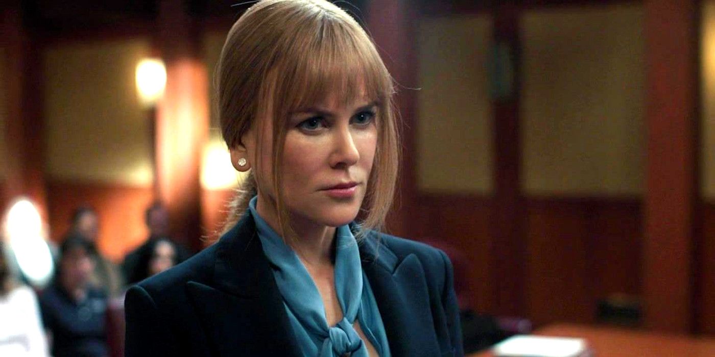 Nicole Kidman In Big Little Lies in a courtroom wearing a suit and scarf