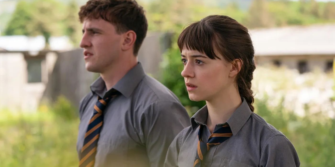 Connell and Marianne wearing school uniforms and staring in the distance in Normal People