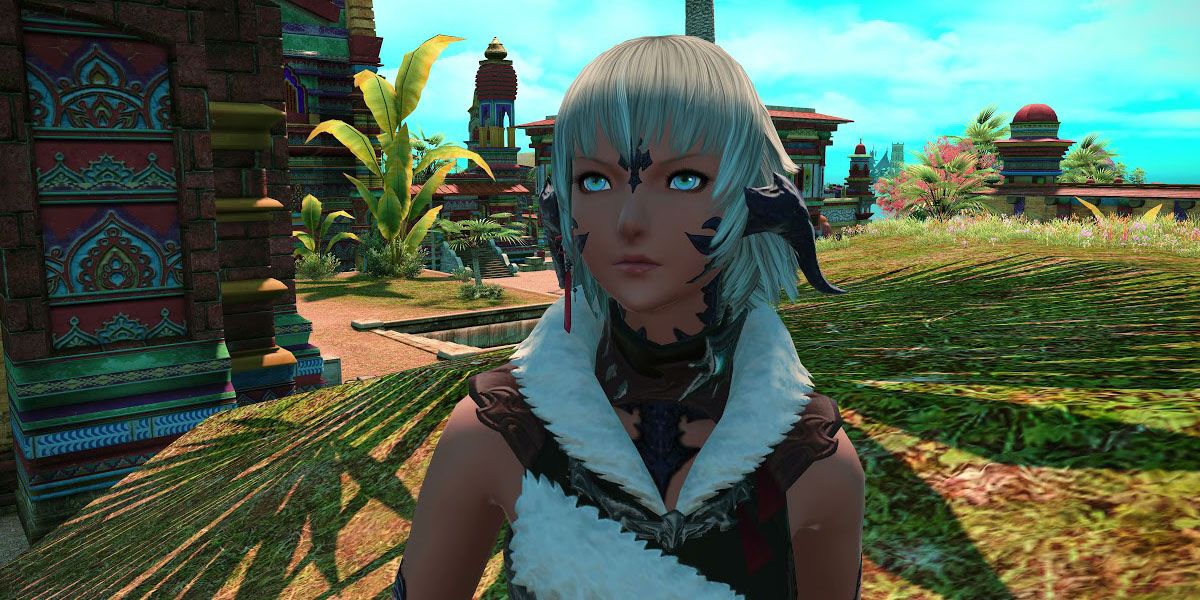 A close-up picture of Ogul in Final Fantasy 14&rsquo;s Thavnair map, surrounded by vegetation and a colorful building.