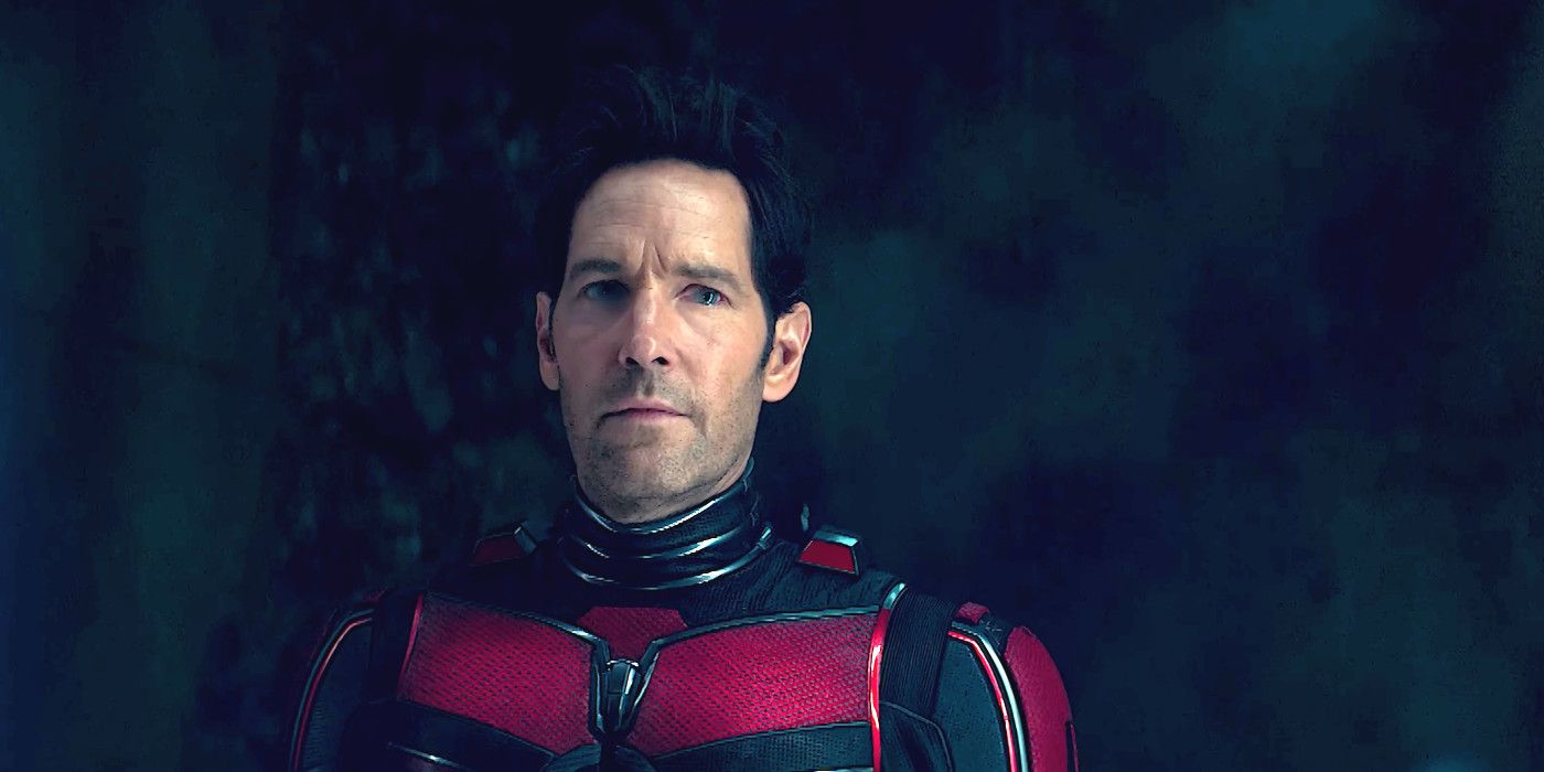 Paul Rudd In Ant-Man And The Wasp Quantumania in his red and black costume looking deadly serious against a dark cavernous backdrop