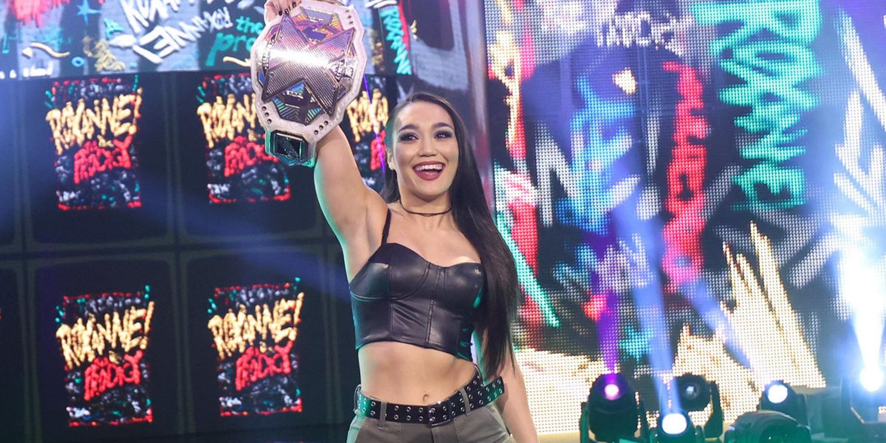 Roxanne Perez makes her entrance with the NXT Women's Championship during an episode of NXT in 2023.