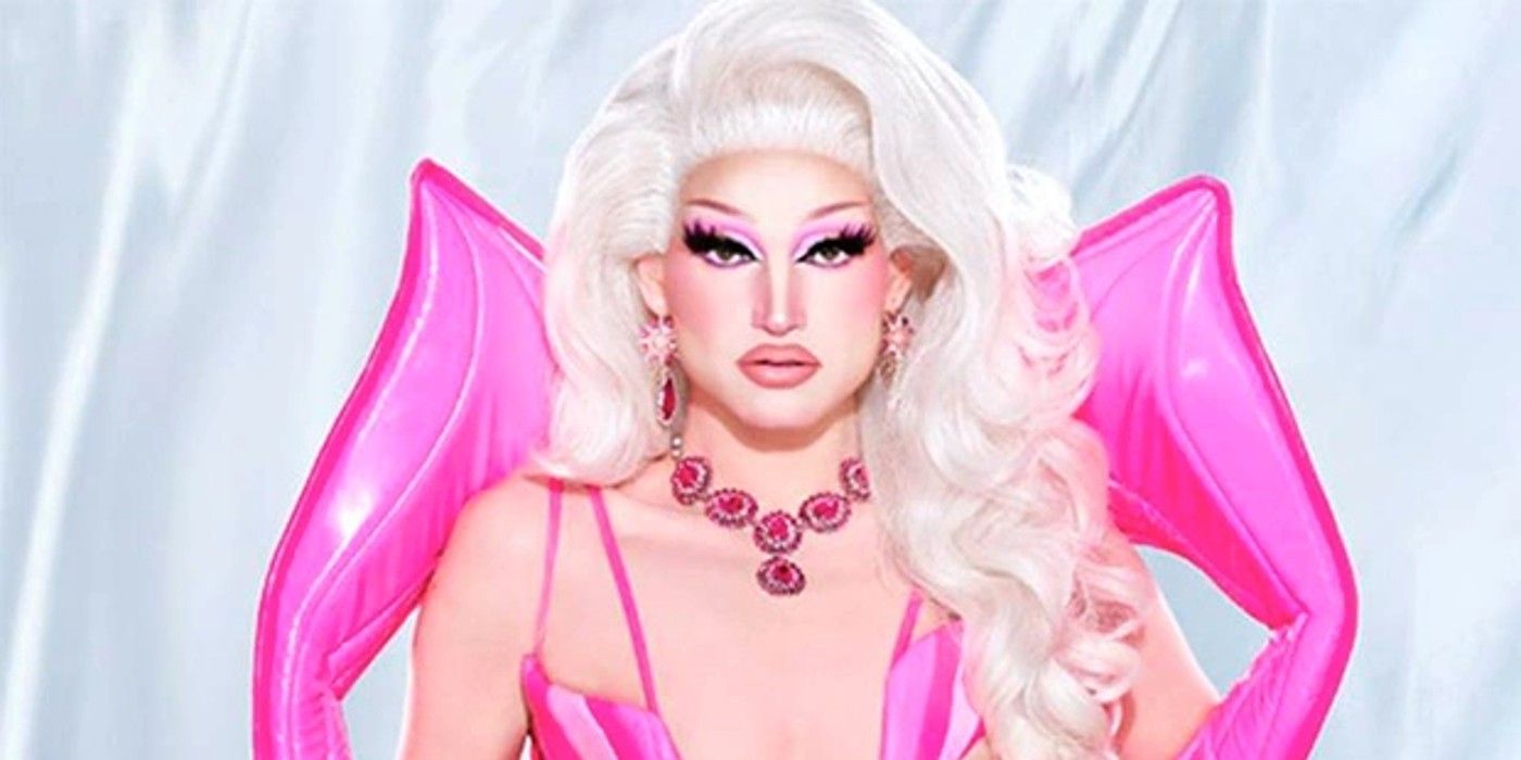 Princess Poppy from RuPaul's Drag Race season 15 in bright all-pink costume with a serious expression
