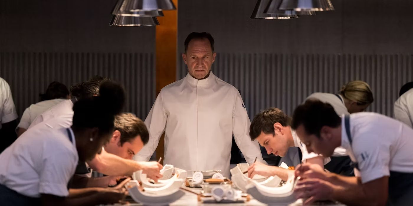 Ralph Fiennes as Chef Slowik looking at his other chefs in The Menu