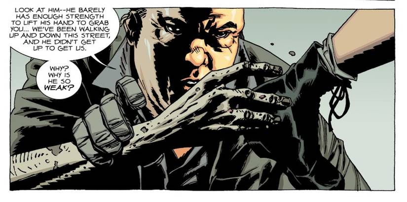 The Walking Dead Deluxe #55, Eugene holds up a dessicated zombie arm, wondering why it is so weak. 