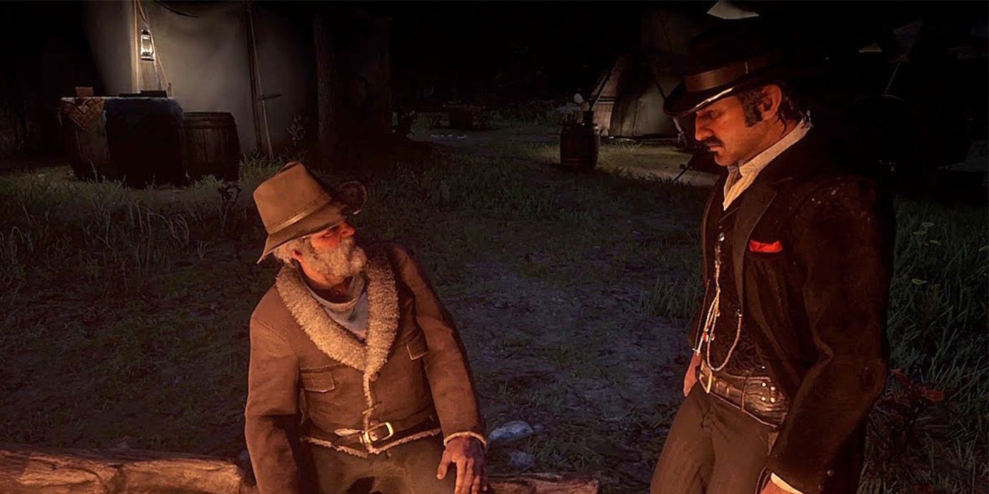 Dutch e Uncle se olhando à noite em Red Dead Redemption 2.