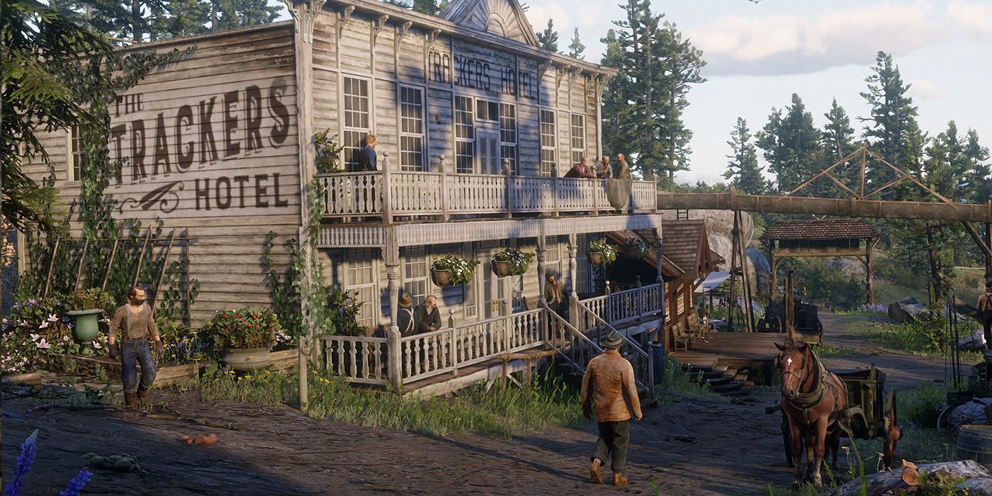 Several Strawberry's resident walking past the Tracker's Hotel in Strawberry in RDR2.
