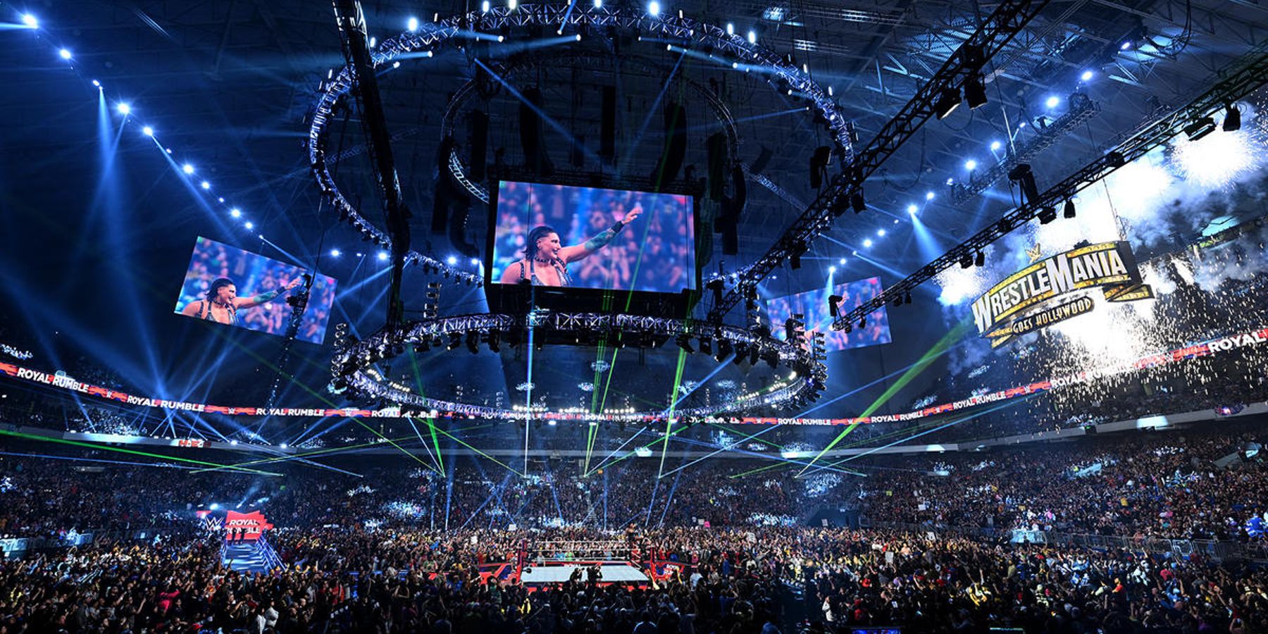 Rhea Ripley points to the WWE WrestleMania 39 sign after winning the Royal Rumble.