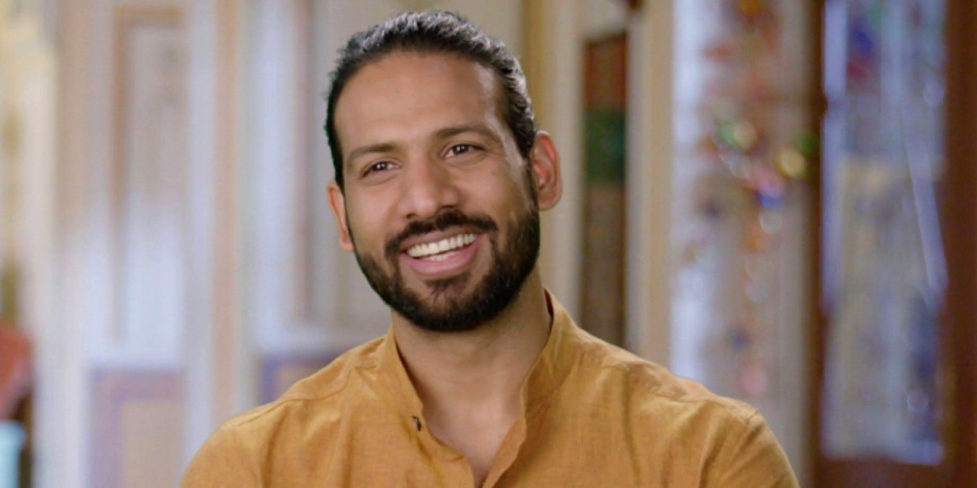 Rishi Singh 90 Day Fiancé wearing yellow shirt smiling