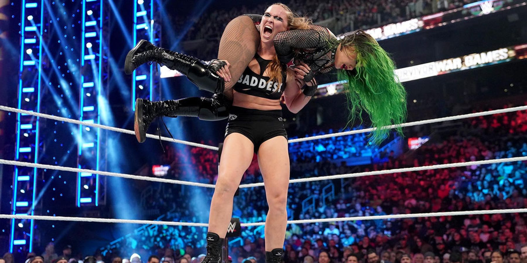 Ronda Rousey picks up Shotzi Blackheart during their match at WWE Survivor Series in 2022.
