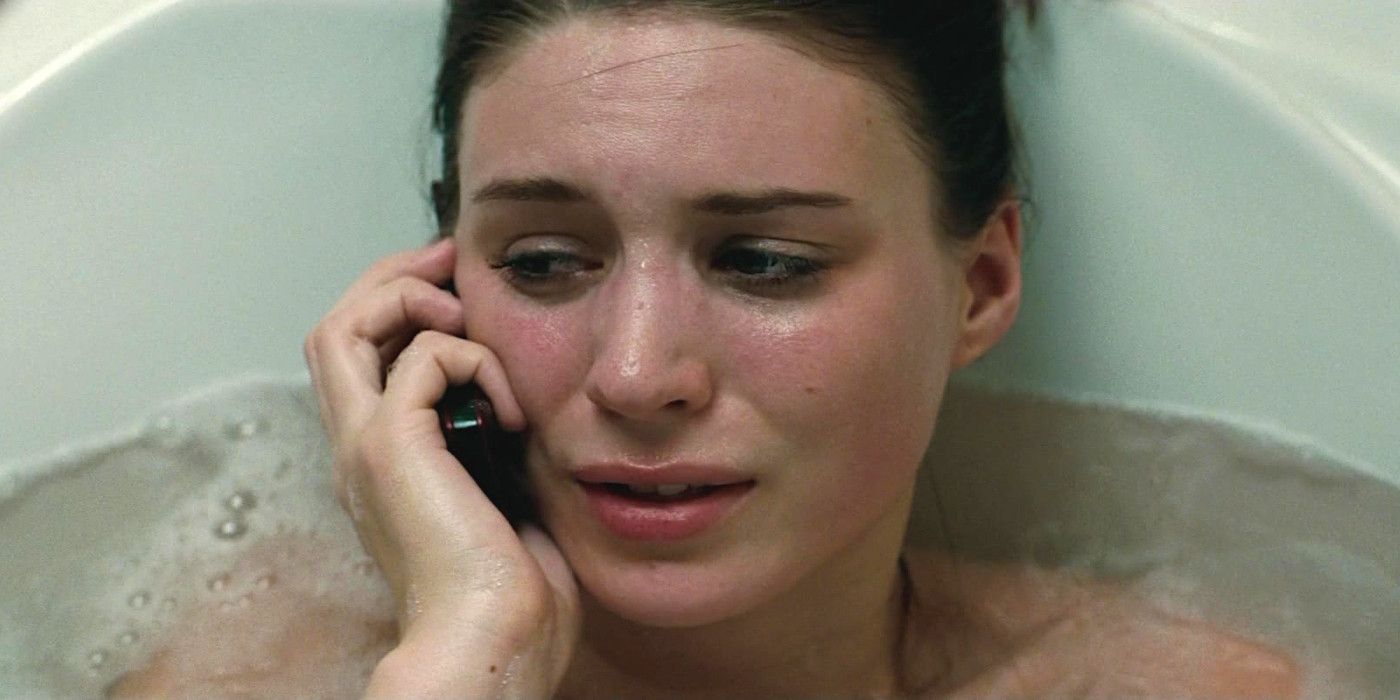 Rooney Mara In Nightmare On Elm Street 2010 in a bathtub talking on the phone, looking fearful