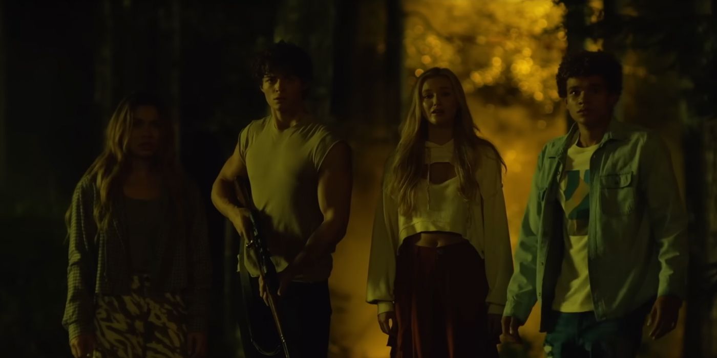 The four teens of the Paramount Plus series Wolf Pack stand together in the woods