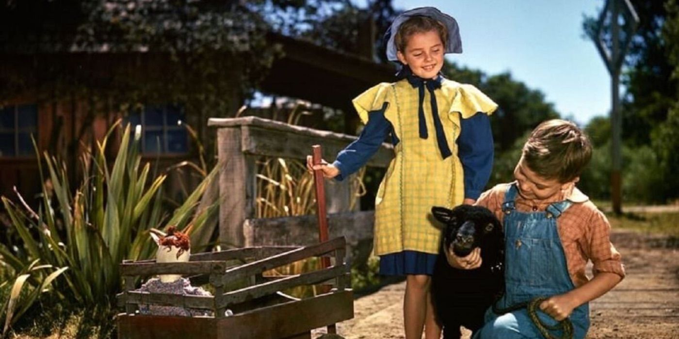 Two children play with farm animals from So Dear To My Heart 