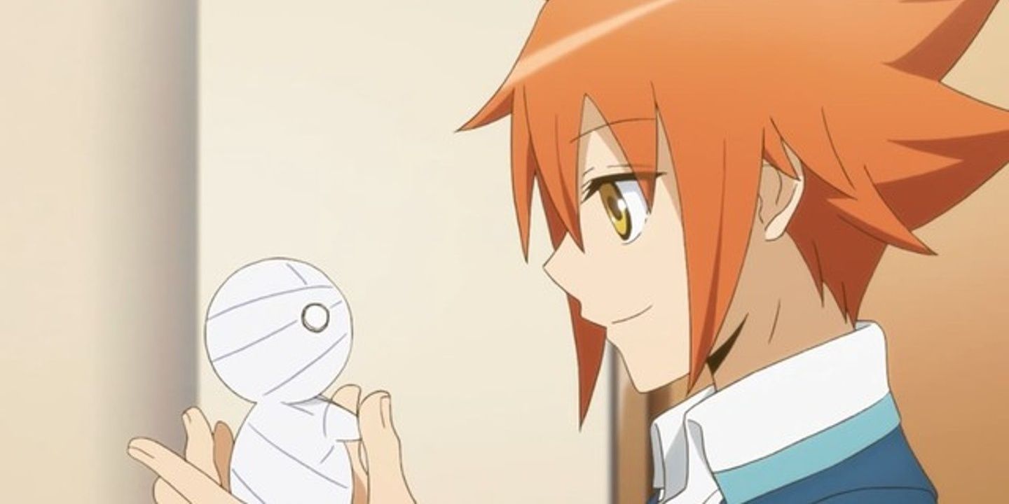 Sora Kashiwagi holds the tiny mummy Mii-kun in the palm of his hand in How to Keep a Mummy.