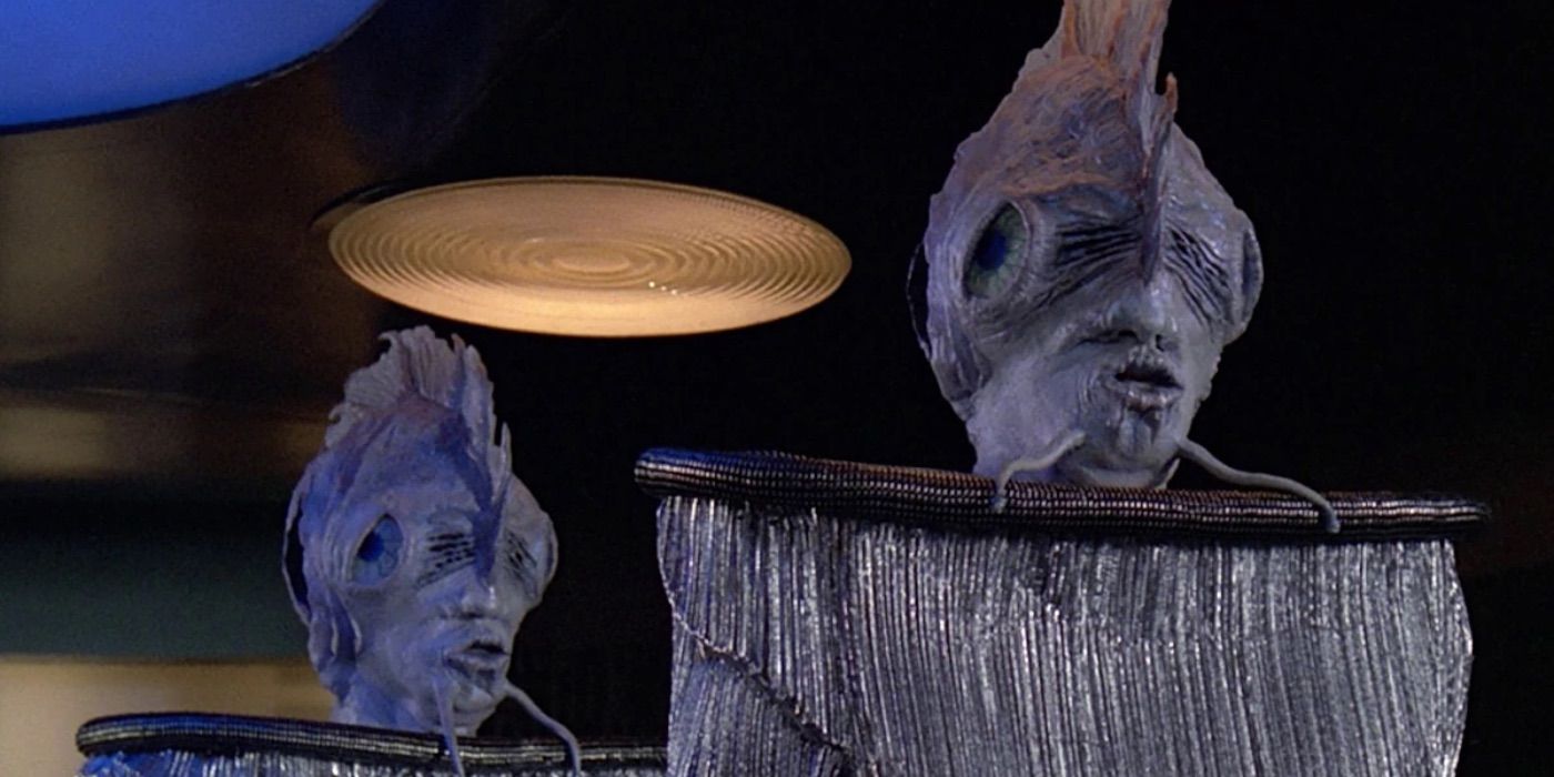 Two Antedeans stand on the transporter pad in Star Trek TNG