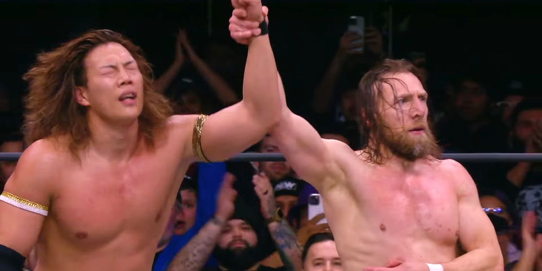 Bryan Danielson raises Konosuke Takeshita's hand after the two had a fantastic match on the January 11 episode of AEW Dynamite.