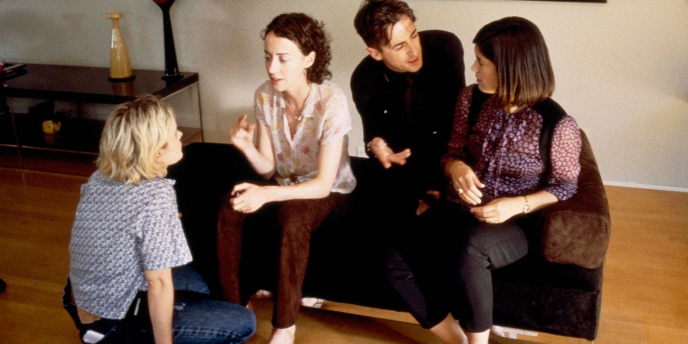  Cates, Jennifer Jason Leigh, Alan Cumming, and Jane Adams sitting together in The Anniversary Party