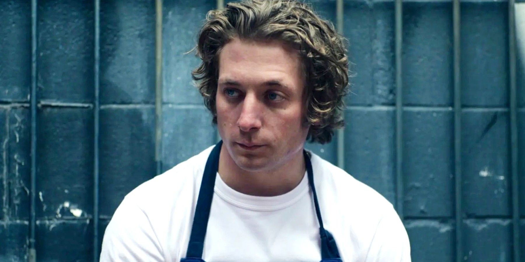 Jeremy Allen White as Carmy wearing a clean white tee in The Bear.