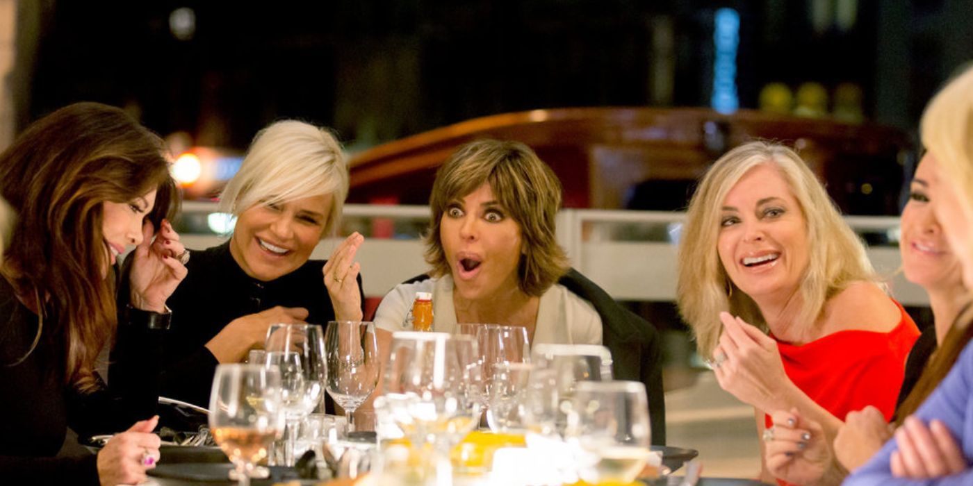 the Housewives of Beverly Hills laughing over drinks