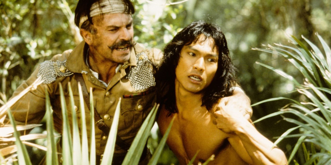 Mowgli helps a man through the jungle in The Jungle Book 