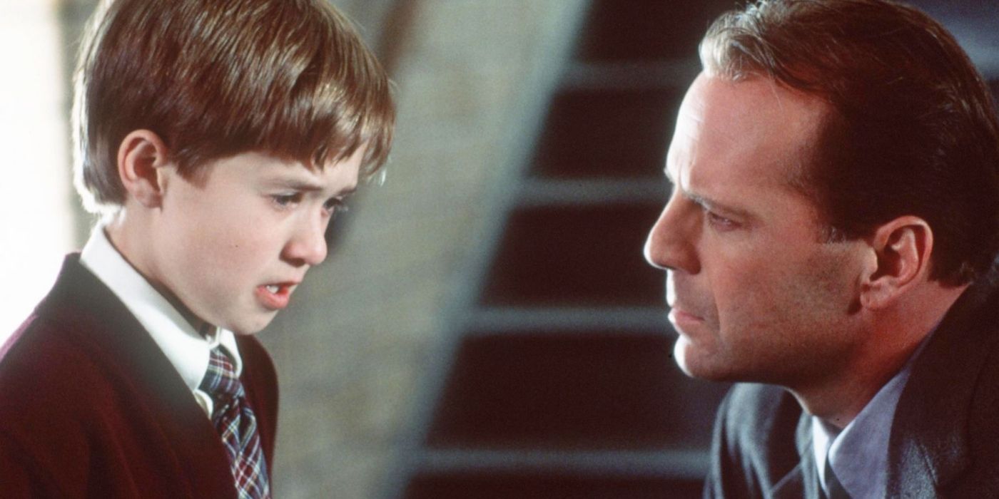 Cole (Haley Joel Osment) and Malcolm (Bruce Willis) talk seriously in The Sixth Sense