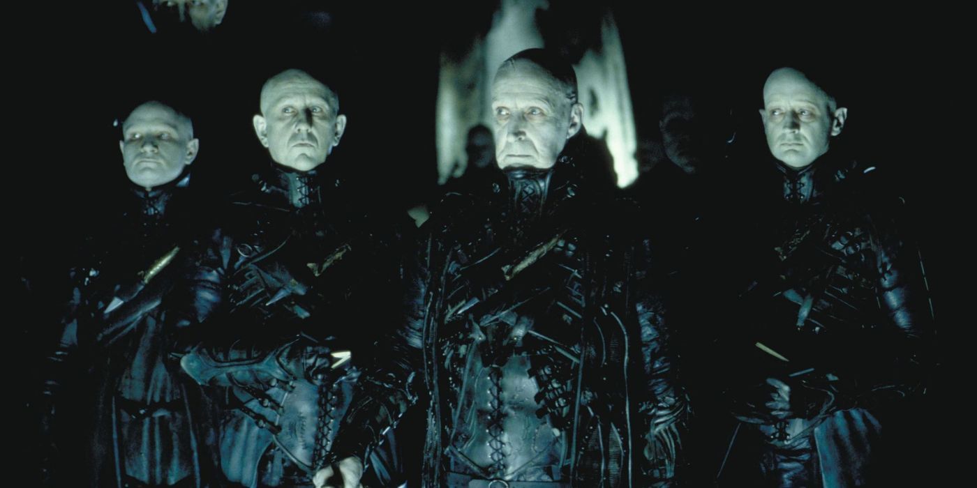 The Strangers standing together in Dark City