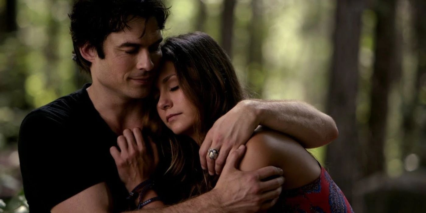 Damon with his arm around Elena in The Vampire Diaries