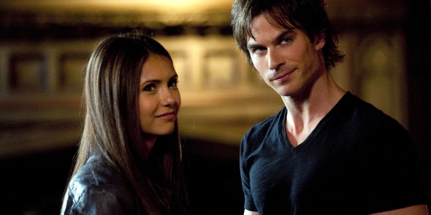 Elena and Damon smiling and staring in the distance in The Vampire Diaries