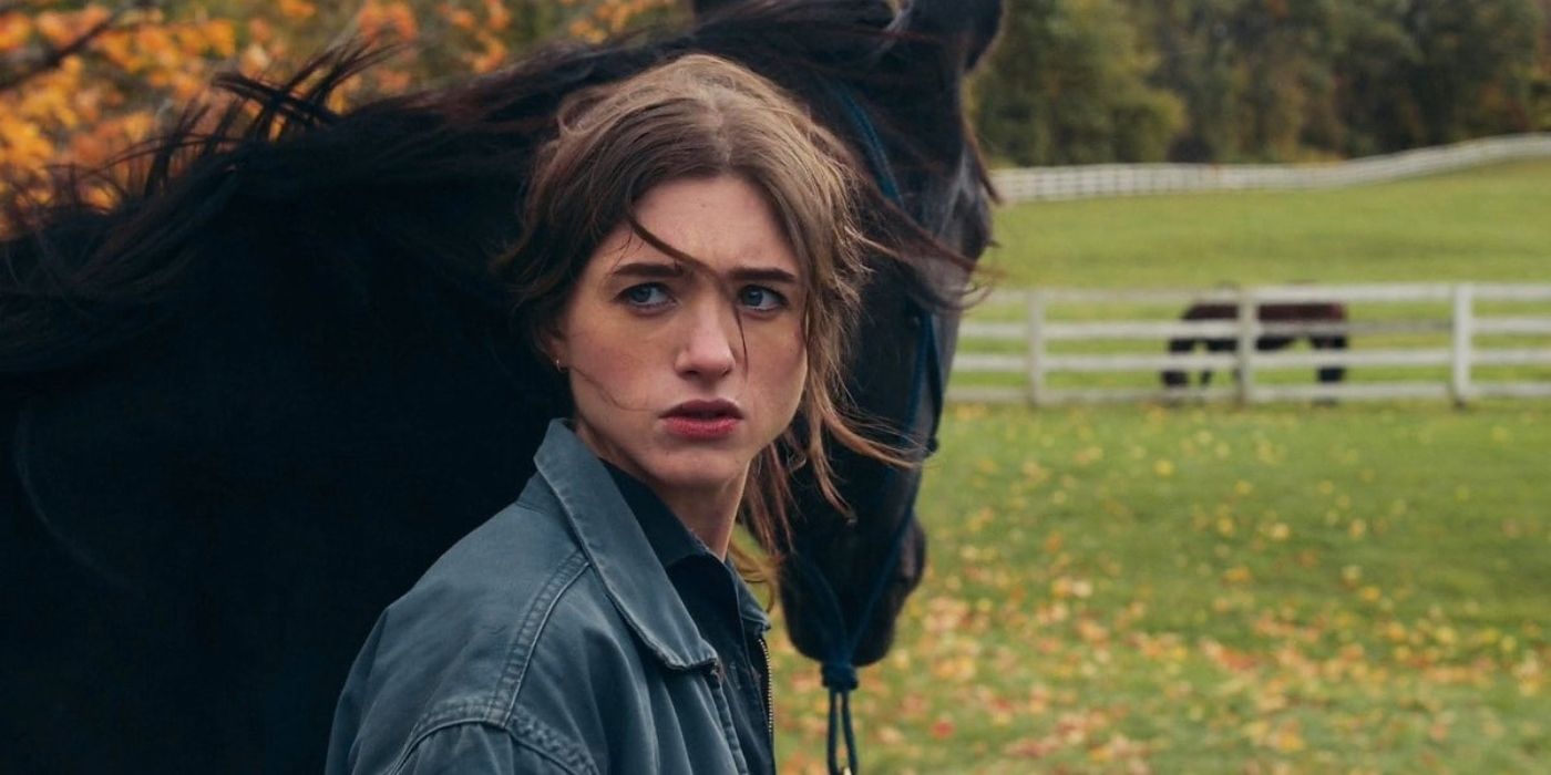 Natalia Dyer as Willis standing with a horse in Things Heard & Seen