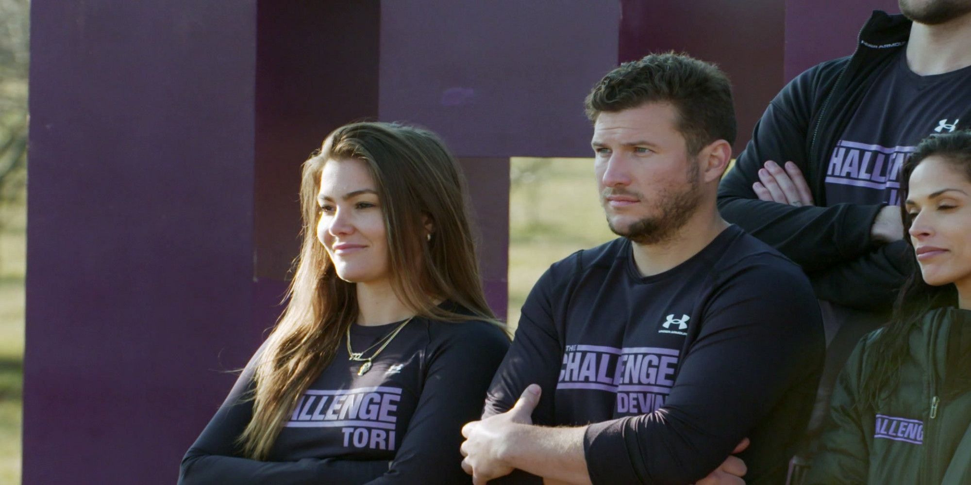 Tori Deal and Devin Walker on The Challenge: Ride or Dies stamding next to each other with crossed arms