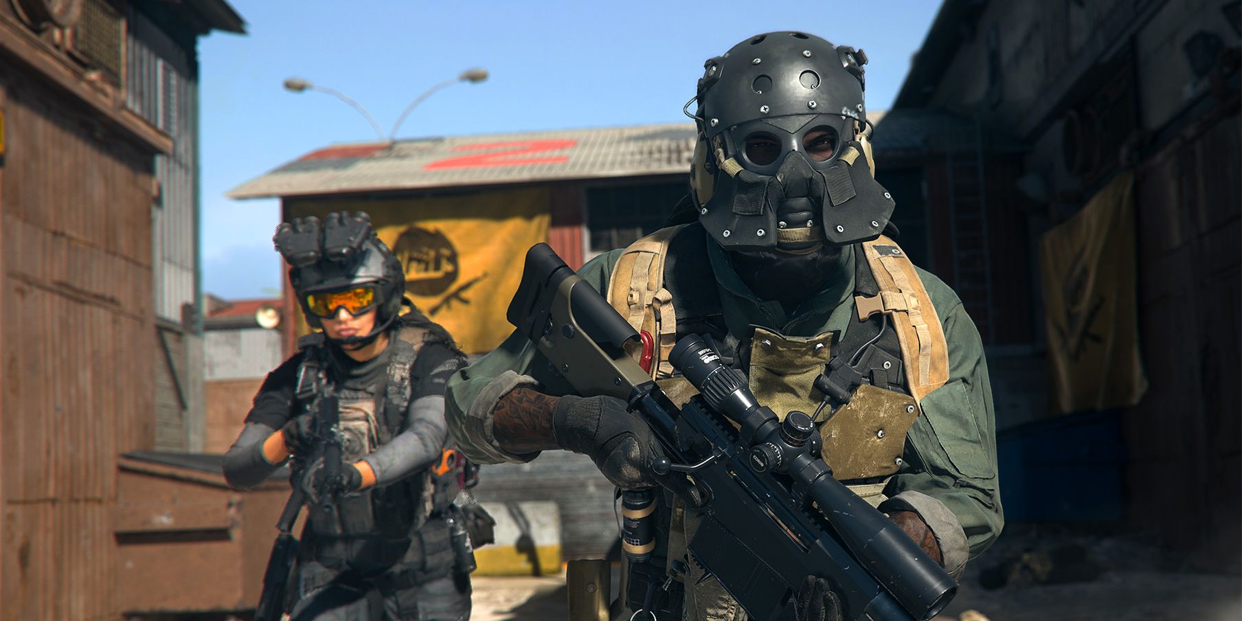 Two heavily armed player characters in Modern Warfare 2's Warzone mode, moving between two buildings.