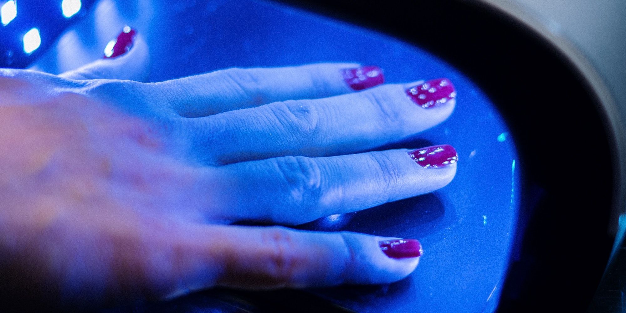 Nails drying under a UV lamp