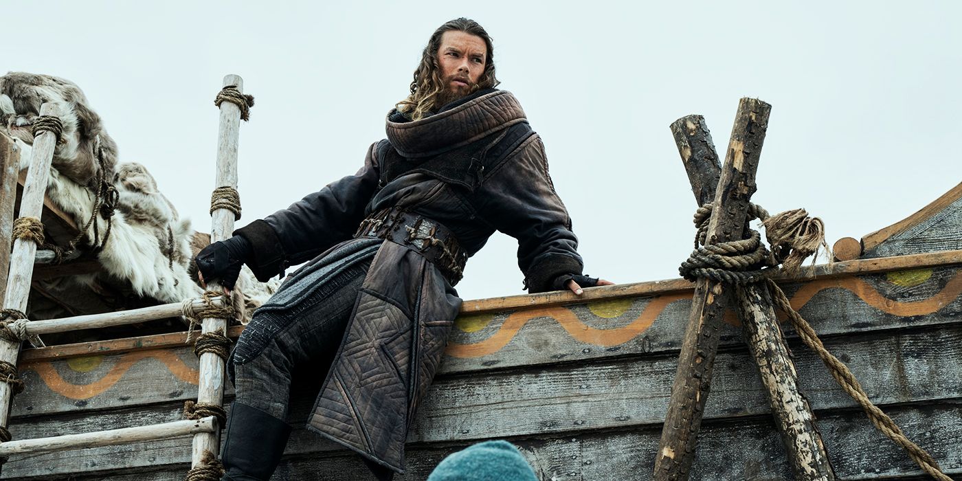 Sam Corlett as Leif Erikson leaning on a boat in Vikings: Valhalla