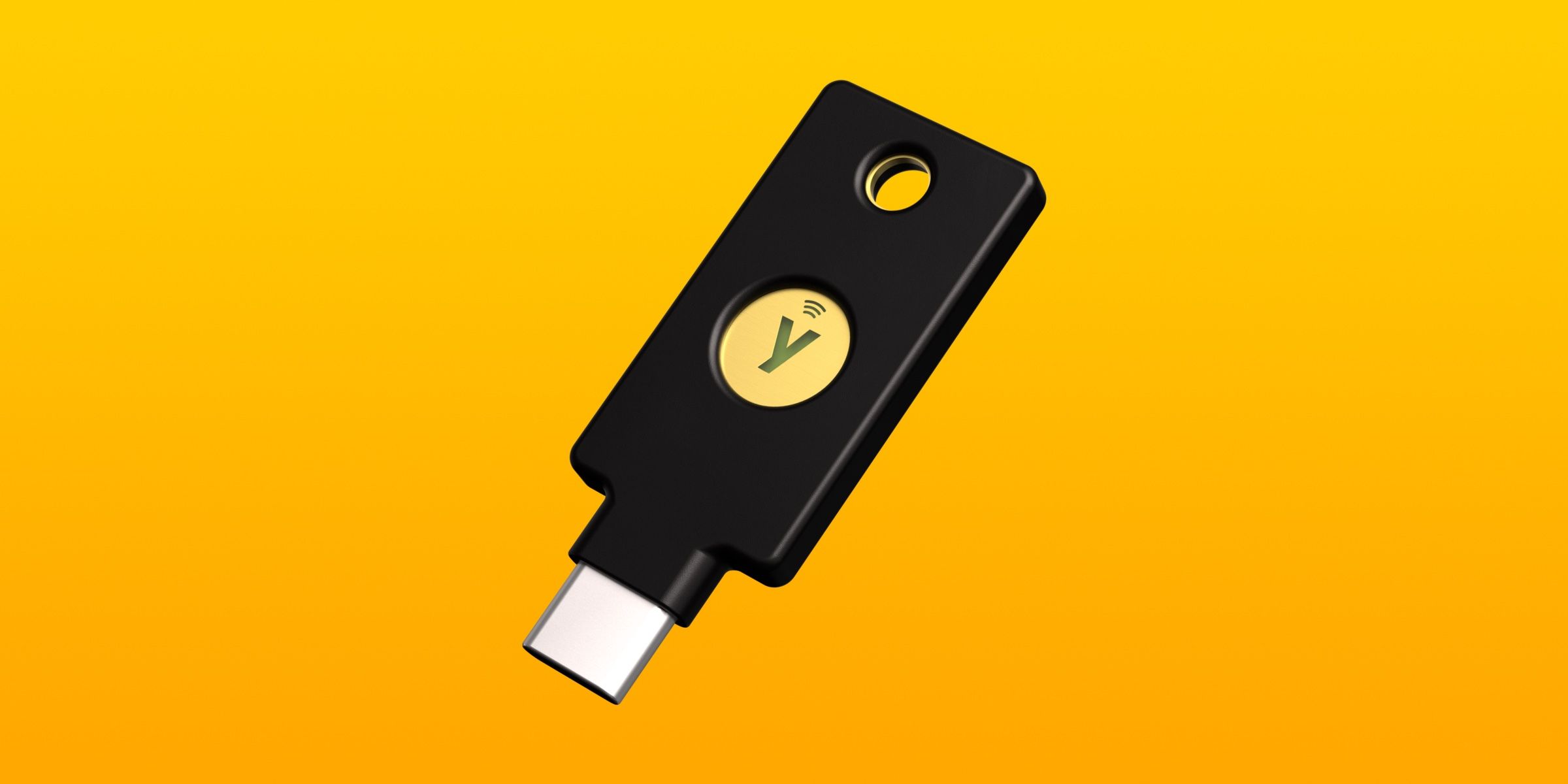 Kunci Keamanan USB-C YubiKey dengan latar belakang gradien kuning.