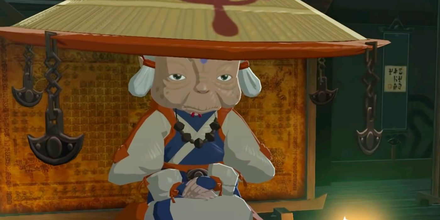 Impa sitting with her hands in her lap on her tall cushion in her Kakariko Village home in The Legend of Zelda: Breath of the Wild.
