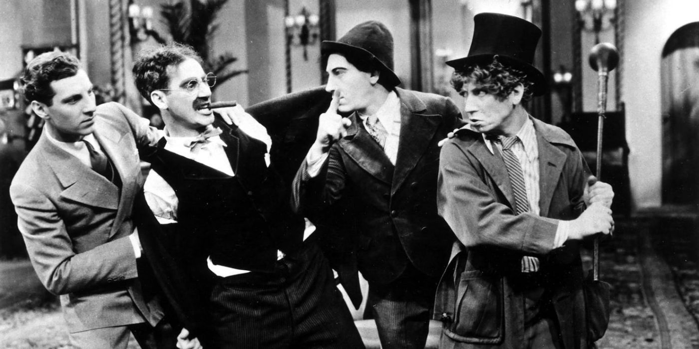 zippo groucho chico and harpo marx all standing in a line fighting with each other