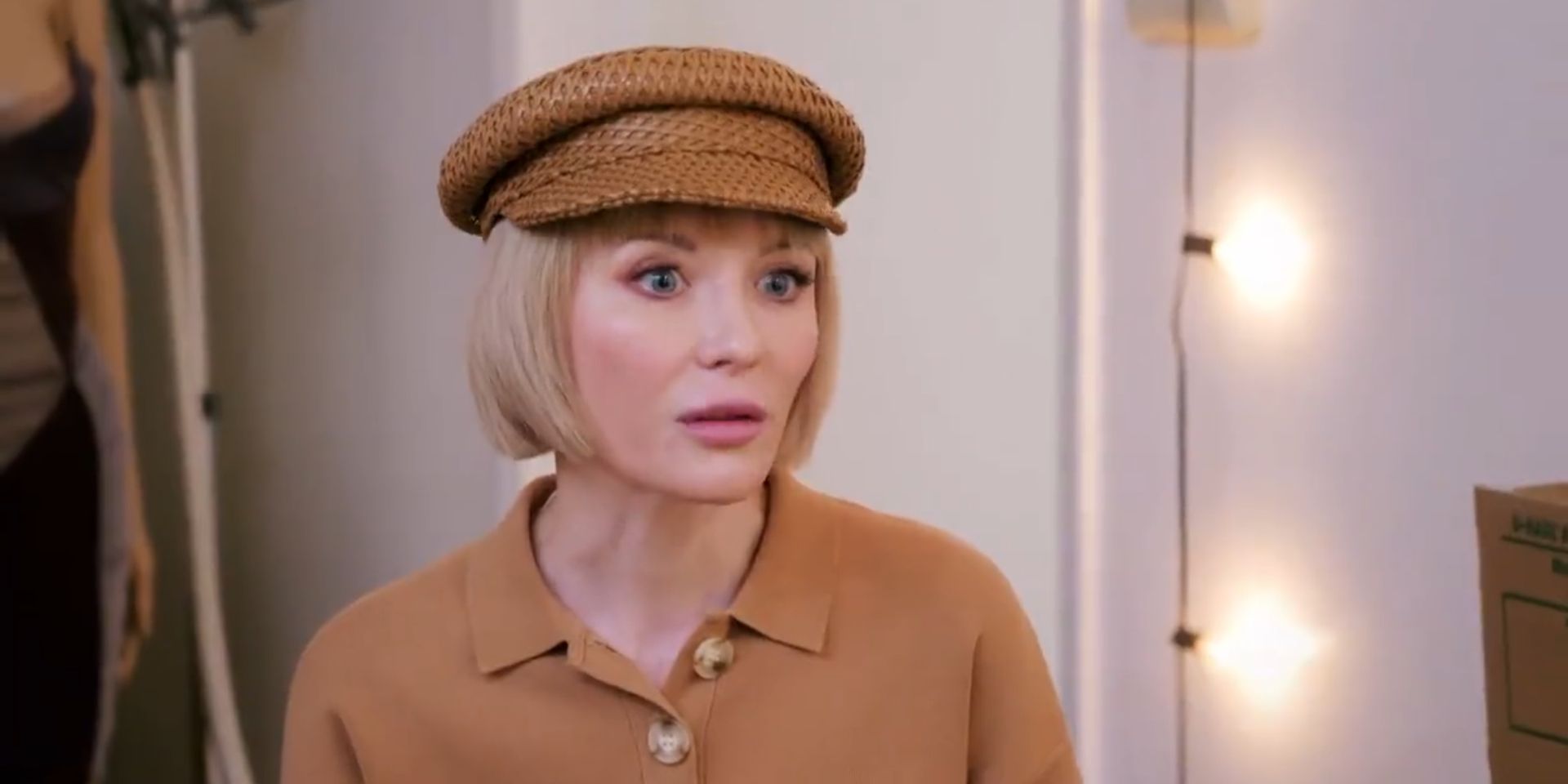 90 Day Fiancé's Nicole Sherbiny wearing a brown hat looking shocked
