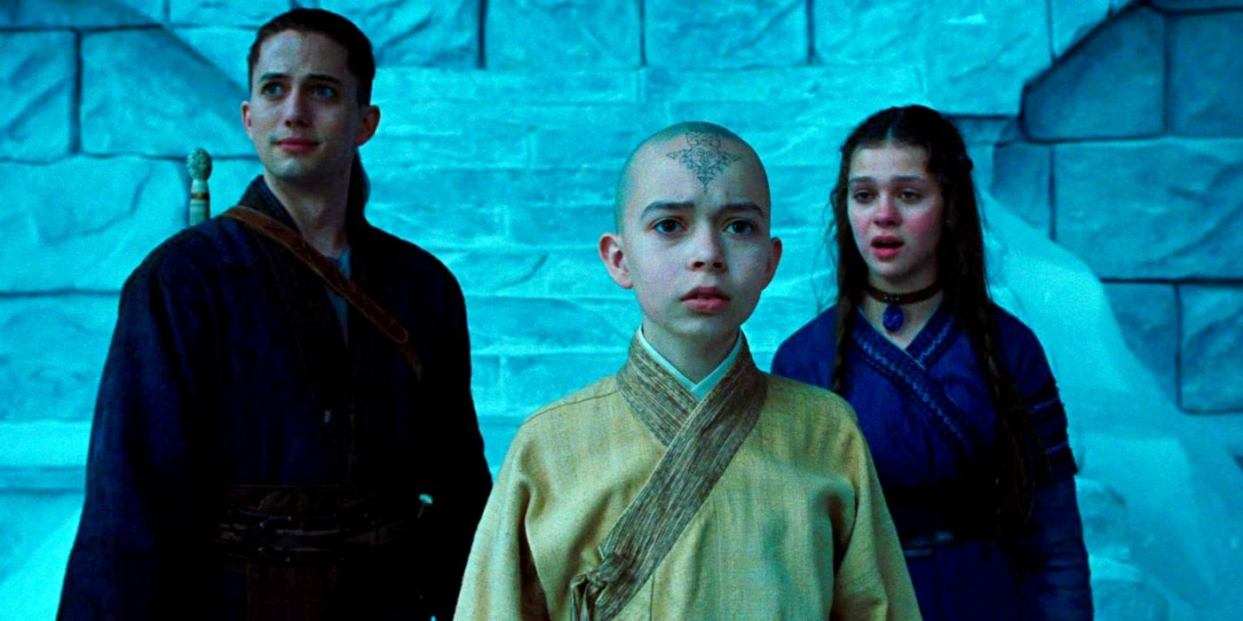 Aang, Sokka, and Kitara stand in front of people in The Last Airbender