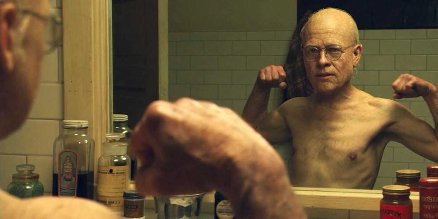 Aged-up Brad Pitt flexing in the mirror in The Curious Case of Benjamin Button