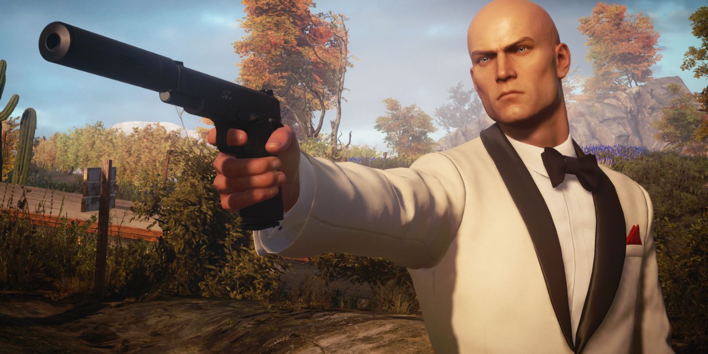 Agent 47 aiming his silenced handgun in Hitman 3.