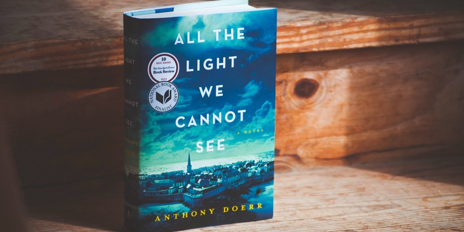 All the Light We Cannot See book on a staircase.