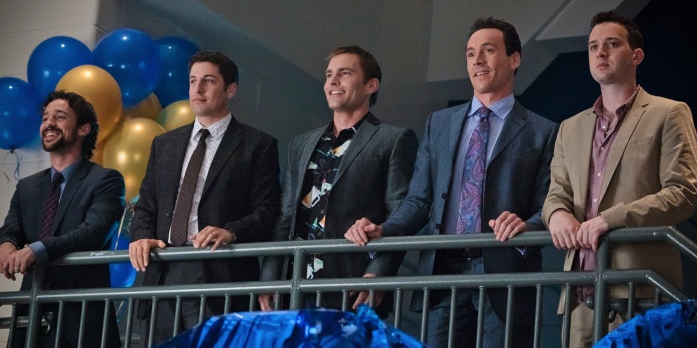 American Reunion key cast members standing by a railing.