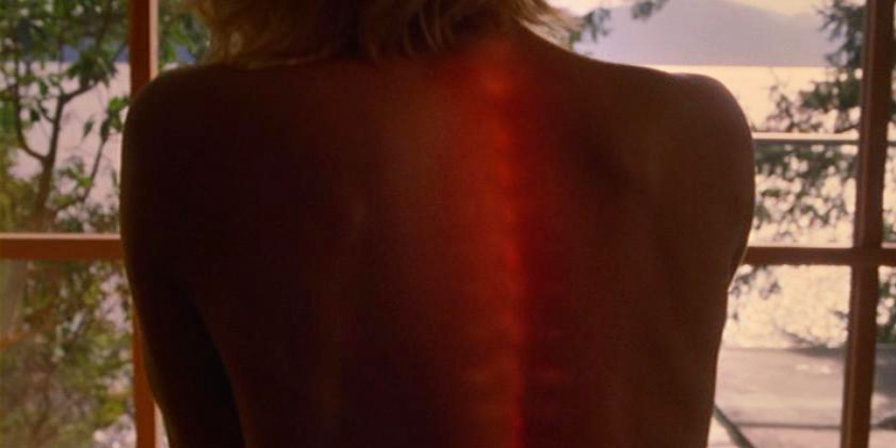 Number Six (Tricia Helfer) and her glowing spine in the Battlestar Galactica miniseries