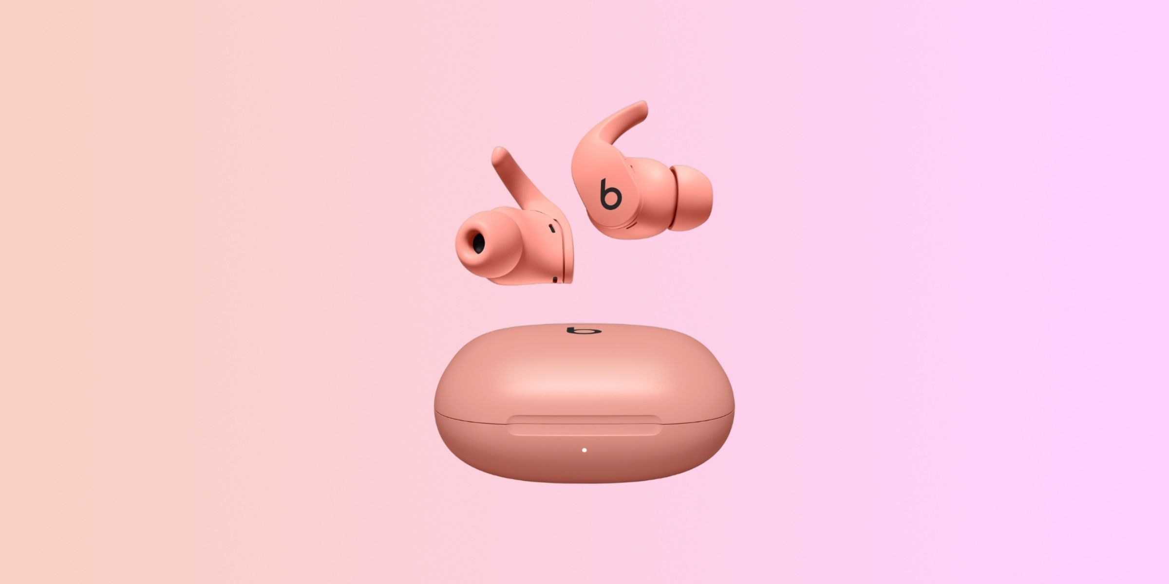 A pair of Beats Fit Pro in the Coral Pink colorway.