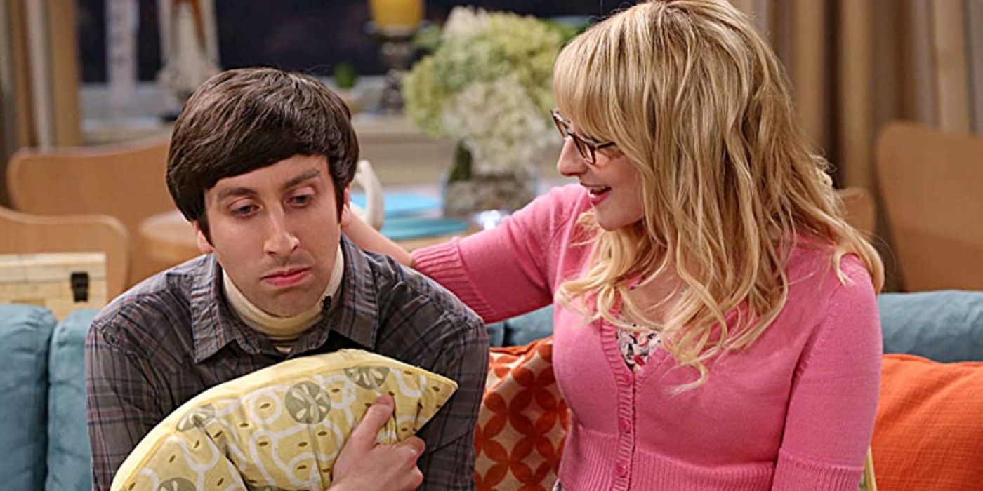 Bernadette comforting Howard on a couch in The Big Bang Theory