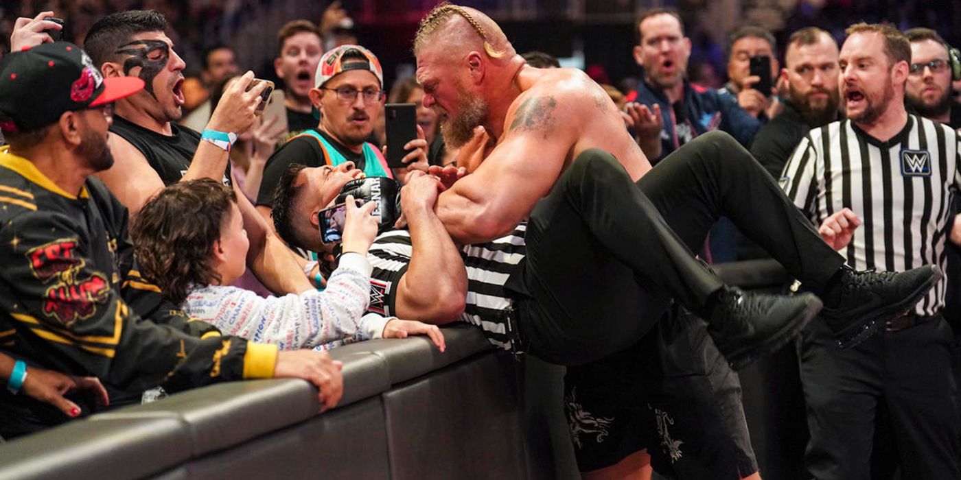 Brock Lesnar attacks a referee after getting eliminated from the Royal Rumble by Bobby Lashley in 2023.