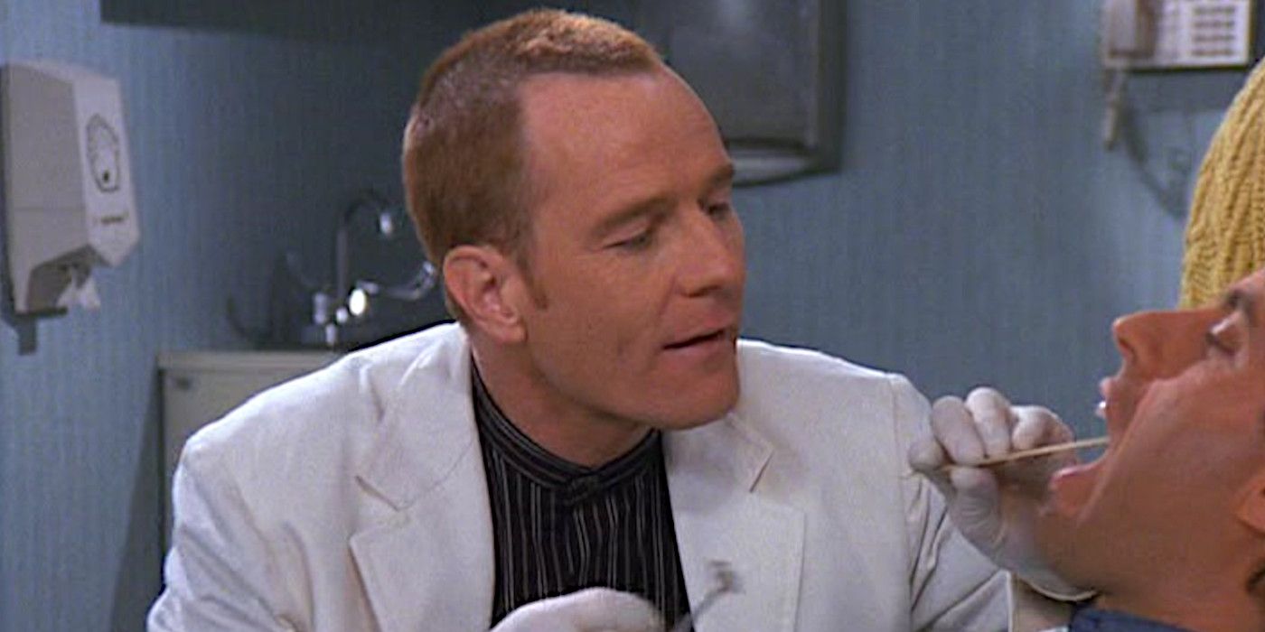Bryan Cranston as Tim Whatley on Seinfeld with a buzz cut giving Jerry an oral exam in a dentist's office