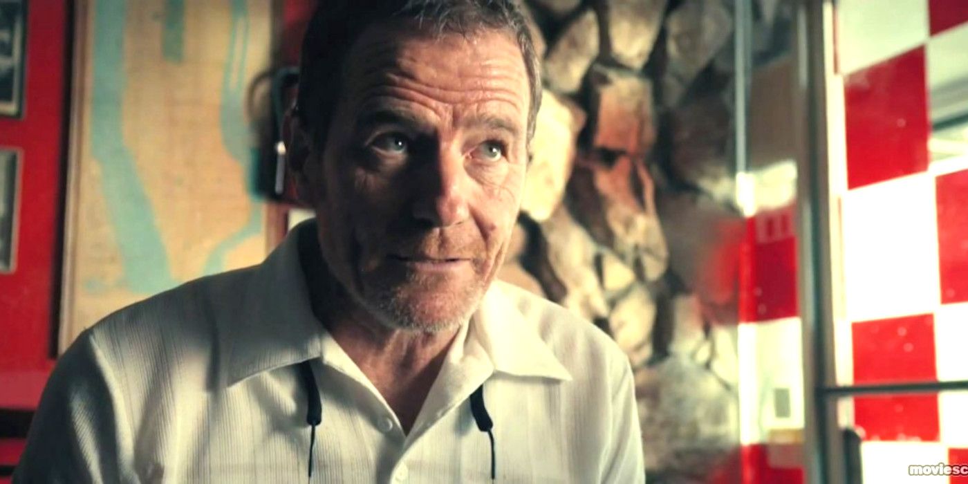Bryan Cranston in Drive seated in a diner, looking up somewhat timidly