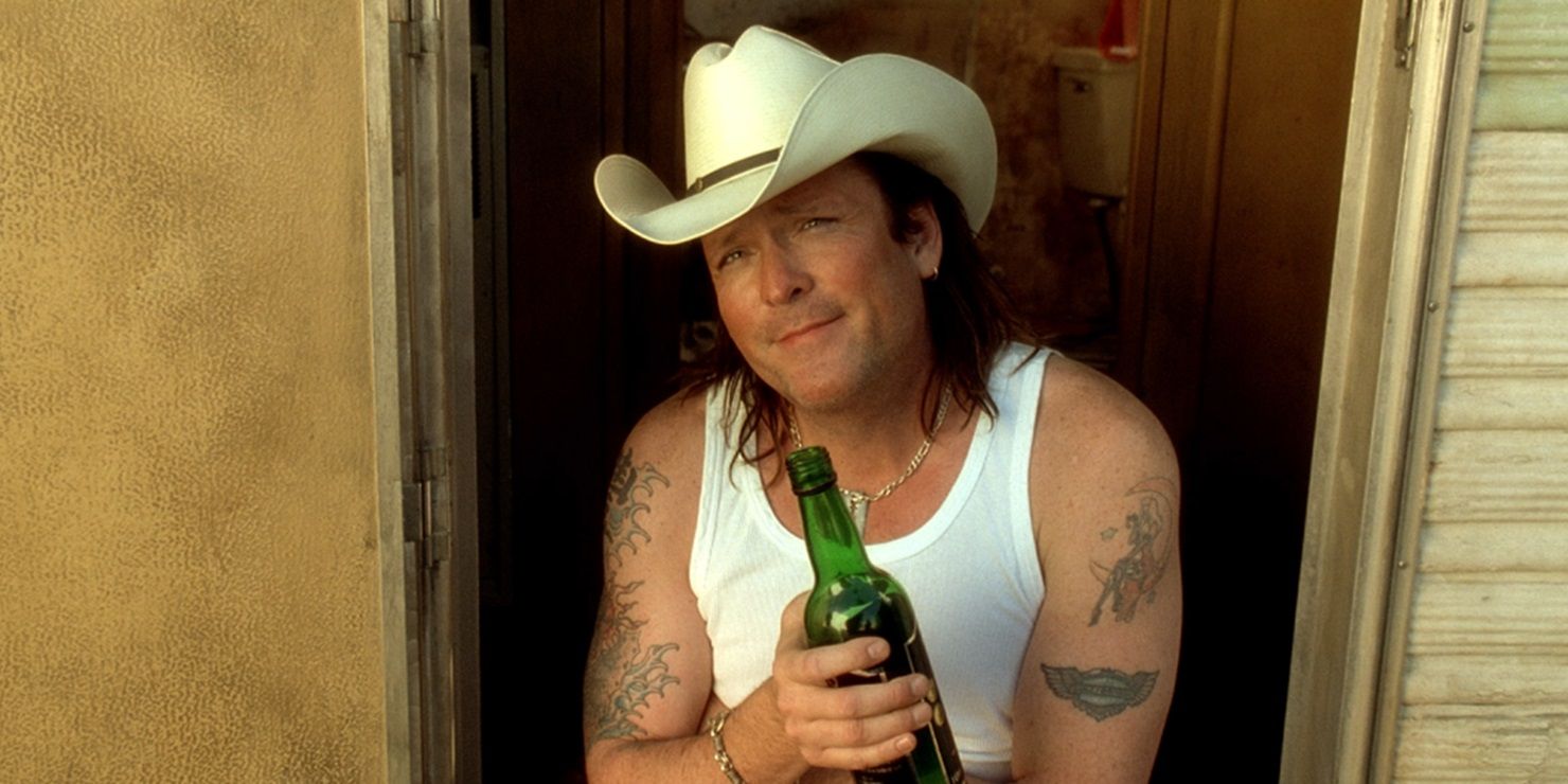 Budd drinking a beer by his trailer in Kill Bill