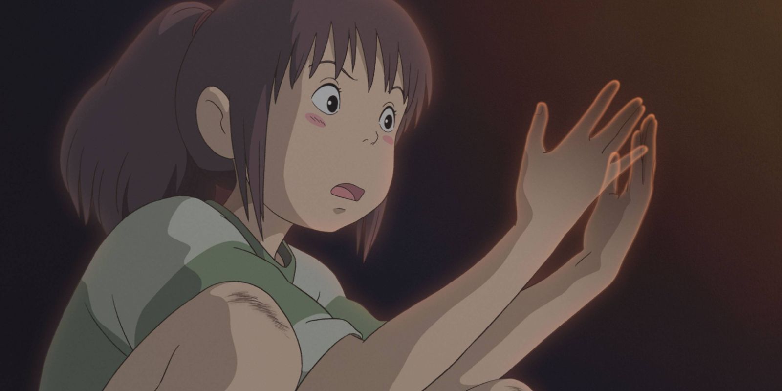 Chihiro's hands disappearing as she looks shocked.