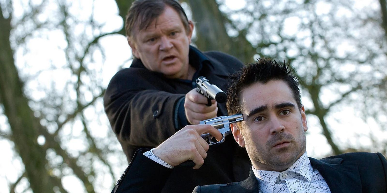 Colin Farrell and Brendan Gleeson with guns in In Bruges